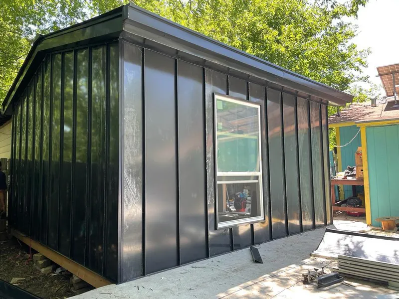 Black standing seam metal wall panels for Roof Inspection in Crockett